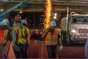 Australian construction crews working the roads at night.